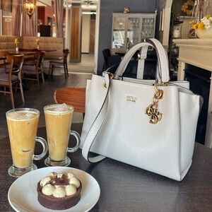 Gold hardware details
Grey and gold
Comes with sling and dust bag